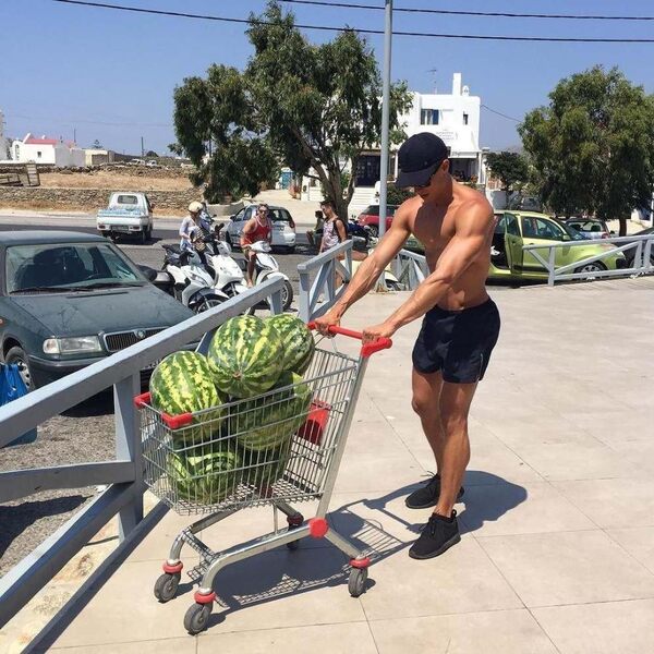 sexy-hunk-carrying-watermelons-shopping-cart.jpg