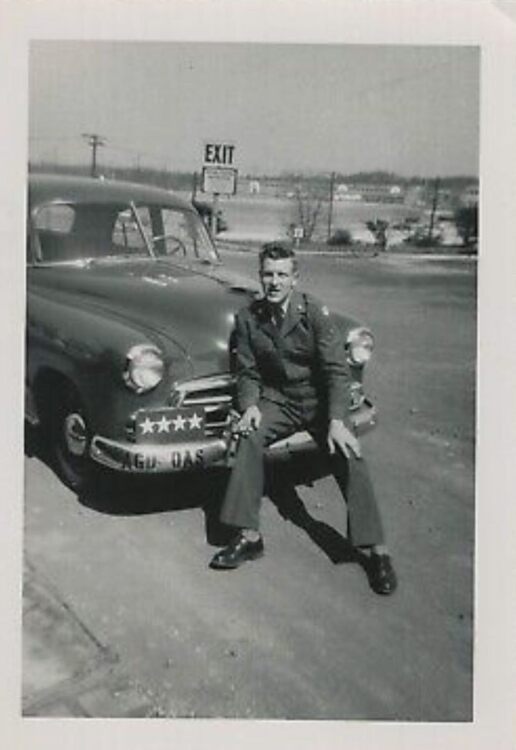 sitting on bumper of car of 4-star general.jpg